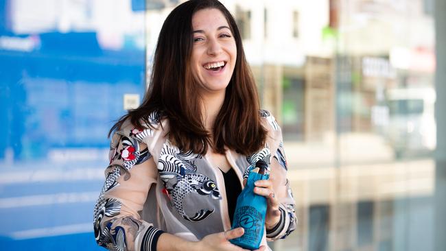 Jordana Clare-Kellett from Crooked Tailor with one of their Doss Blockos beers. Pictures: Jordan Shields