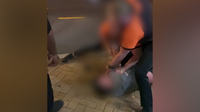 Security guards have been filmed slapping a man outside a Brisbane hotel.