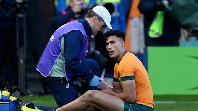 EDINBURGH, SCOTLAND - NOVEMBER 24: Joseph-Aukuso Suaalii of Australia reacts as he receives medical treatment after sustaining an injury, before later leaving the field, during the Autumn Nations Series 2024 match between Scotland and Australia at Scottish Gas Murrayfield on November 24, 2024 in Edinburgh, Scotland. (Photo by Stu Forster/Getty Images)