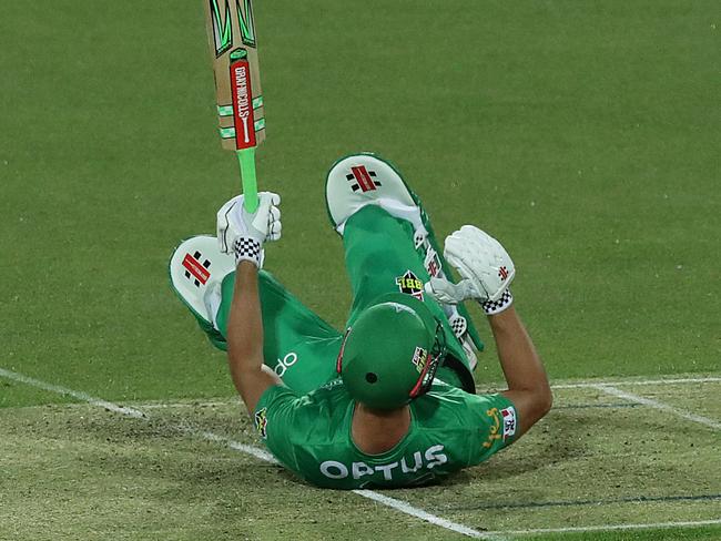 A stunned Stoinis falls back on to the wicket after the frightening strike.