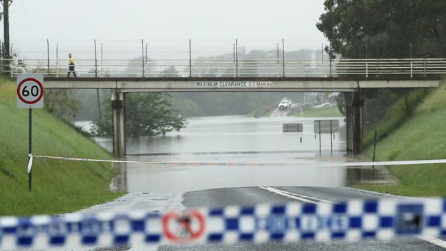 Police tape marks a flooded road between Richmond and Windsor in western Sydney as floodwaters continue to rise. Picture: Mark Kolbe/Getty Images