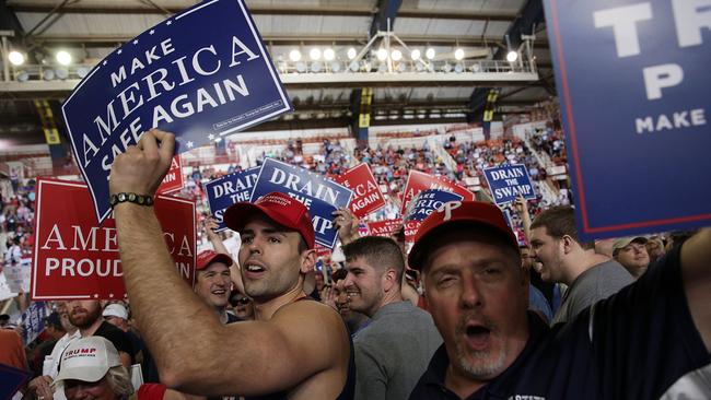 Donald Trump supporters wave signs at a ‘Make America Great Again’ rally in Pennsylvania during the Farm Show Complex &amp; Expo. Picture: AFP