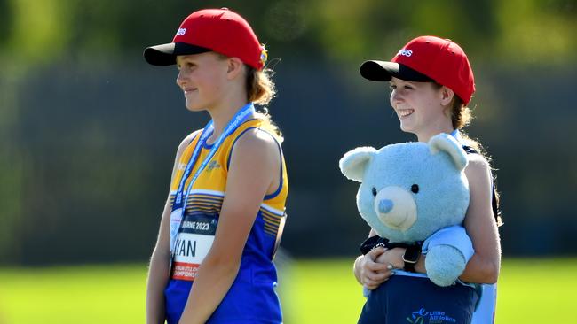 Silver medallist Jillian Ryan (ACT) and Gold medallist Sophie Polkinghorne (NSW) pose on the podium after competing in the Girls U13 1500m Walk.