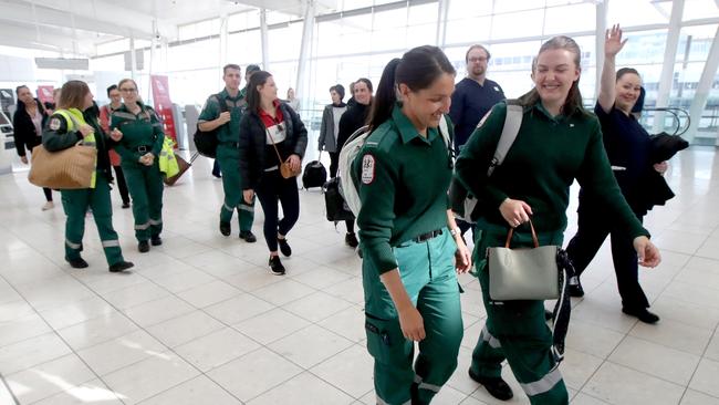 South Australian nurses and paramedics at the Adelaide Airport to board a Qantas flight to Melbourne, answering an urgent call for help. Picture: NewsWire/Kelly Barnes