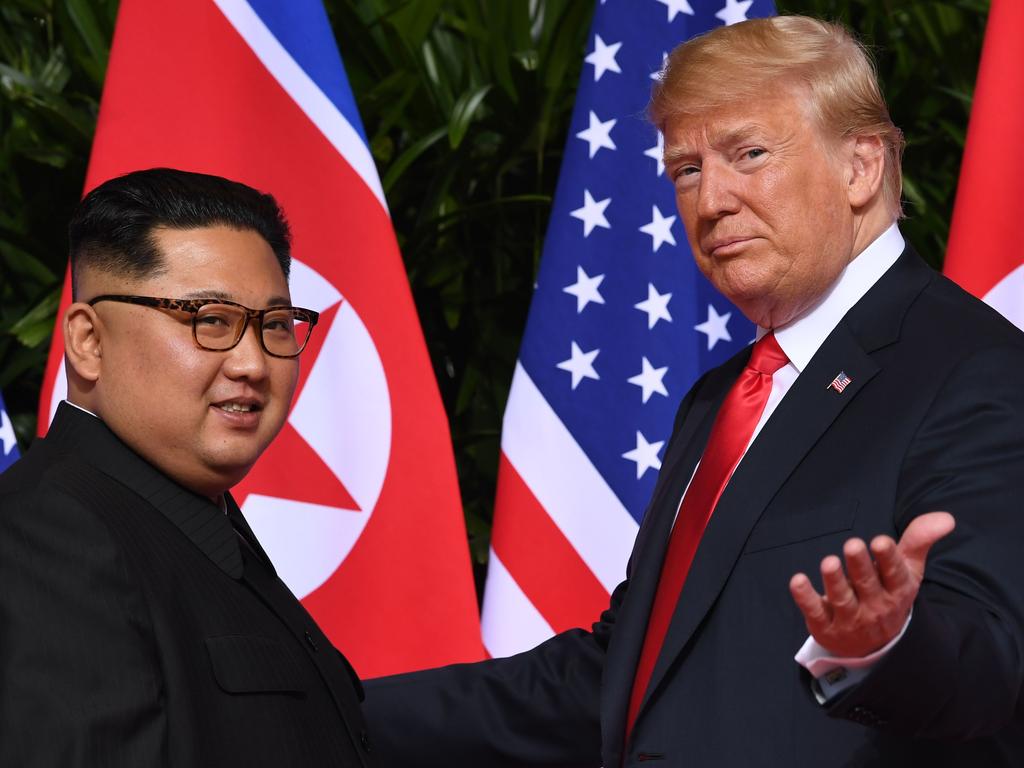 Donald Trump gestures as he meets with North Korea's leader Kim Jong-un at the start of their historic US-North Korea summit, at the Capella Hotel on Sentosa Island in Singapore. Picture: AFP