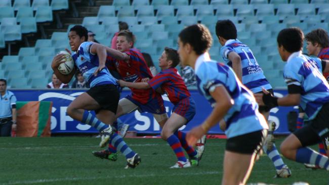 Siosifa Talakai on the charge for the Mascot Jets in the under-13s grand final in 2010. Picture: Steve Montgomery/OurFootyPics.com.au