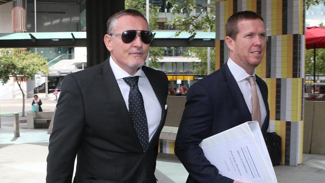 Jason Murakami arrives at Brisbane Magistrates Court court with legal representive Adam Guest during his 2015 trial.