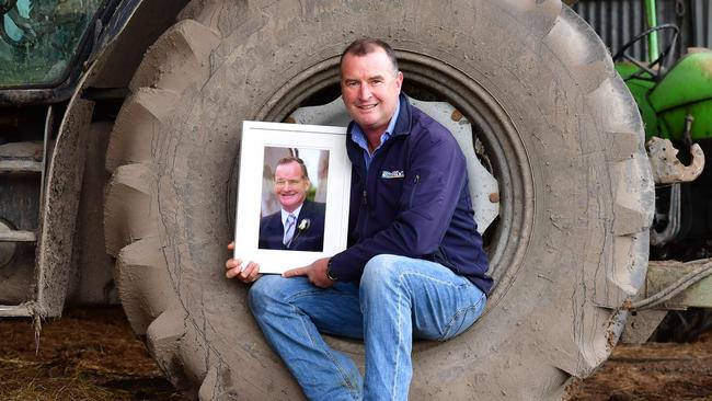 NEWS: Whelan Family legacyVictorian cattle farmer Max Whelan, died in a farming accident in 2021. He donated organs and saved multiple lives. Today, his wife and adult children reflect on how his legacy lives on in these donations and the family farm they work together to run.PICTURED: Alan Whelan on the family farm with a photo of his dad MaxPICTURE: ZOE PHILLIPS