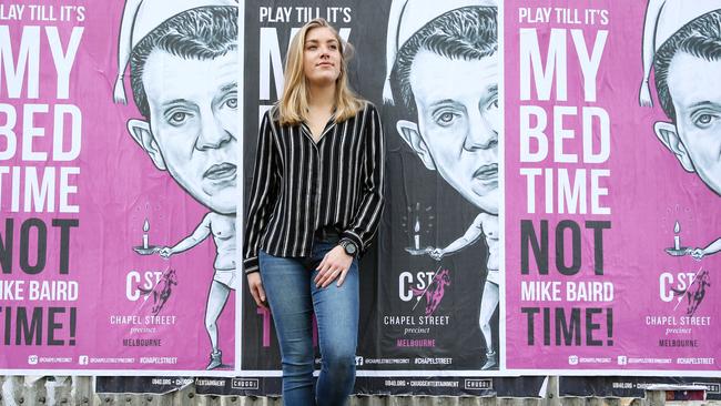Attalie Rousselot, 20, barmaid from Wynyard Hotel standing in front of posters promoting Melbourne night-life, in Sydney CBD. Picture Craig Greenhill
