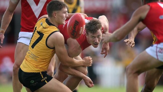 Glenelg’s Reid Kuller, tackles North’s Campbell Combe. Picture: Dean Martin