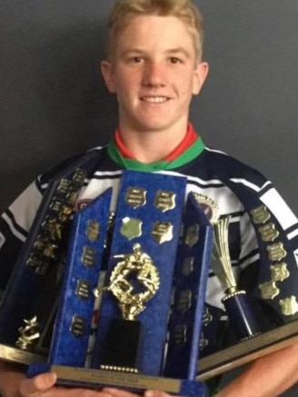 A young Tom Dearden with a haul of trophies in his junior Brothers Bulldogs days. Picture: Supplied.