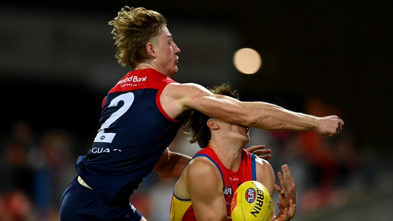 GOLD COAST, AUSTRALIA - MAY 06: Charlie Ballard of the Suns suffers an injury while challenging for the ball against Jacob van Rooyen of the Demons during the round eight AFL match between the Gold Coast Suns and the Melbourne Demons at Heritage Bank Stadium, on May 06, 2023, in Gold Coast, Australia. (Photo by Albert Perez/AFL Photos via Getty Images)