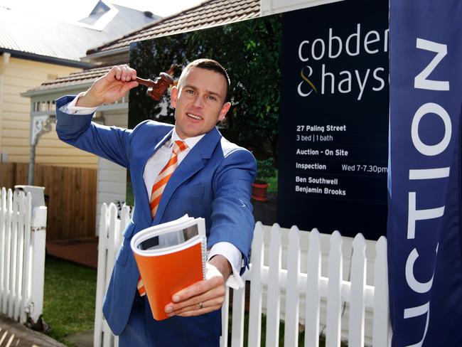 Super Saturday auction action where 27 Paling St Lilyfield in Sydney's inner west sold under the hammer for $1.942m. Auctioneer Damien Cooley in action. Picture: Toby Zerna