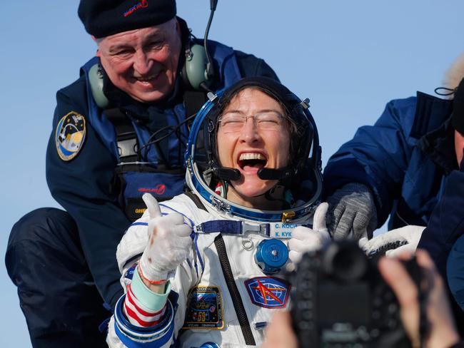 TOPSHOT - NASA astronaut Christina Koch reacts shortly after landing in a remote area outside the town of Dzhezkazgan (Zhezkazgan), Kazakhstan, on February 6, 2020. - NASA's Christina Koch returned to Earth safely Thursday having shattered the spaceflight record for female astronauts after almost a year aboard the International Space Station. Koch touched down at 0912 GMT on the Kazakh steppe after 328 days in space along with Luca Parmitano of the European Space Agency and Alexander Skvortsov of the Russian space agency. (Photo by Sergei ILNITSKY / POOL / AFP)