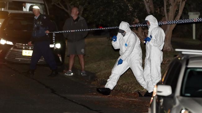 Forensic police canvas the street. Picture: David Swift