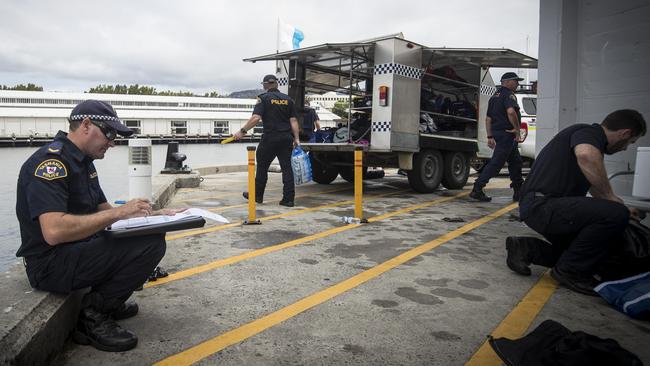 Tasmanian police divers at Elizabeth Street Pier in Hobart. Picture: Luke Bowden