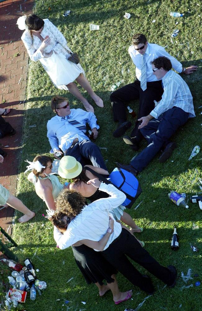 Punters make the most of new friendships and the afternoon sun after the last race at Flemington.