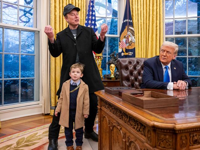 Tesla and SpaceX CEO Elon Musk makes a typically quirky debut appearance in the Oval Office with his son X. Picture: AFP