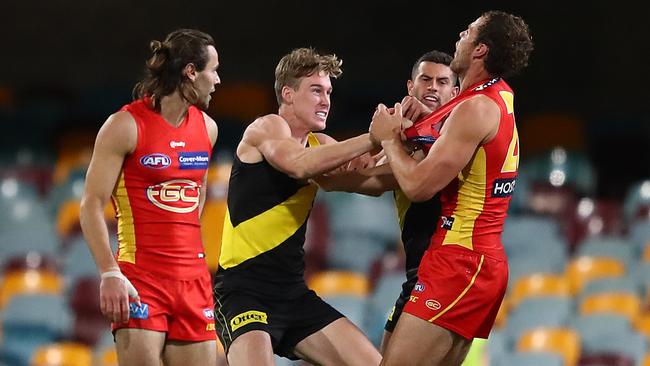 Under-fire Richmond forward Tom Lynch scuffles with Gold Coast’s Jarrod Witts on Monday night. Picture: Getty Images