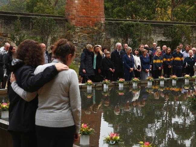 Family and community members lay 35 floral tributes in the Memorial Pool to remember victims during the 20th anniversary commemoration service of the Port Arthur massacre on April 28, 2016. Picture: ROBERT CIANFLONE/GETTY IMAGES