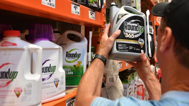 A customer buys Roundup in a California store. Picture: AFP