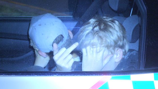 Two boys sit in the back of a police car after a crash at Burleigh in April last year. Picture: LLN AUS