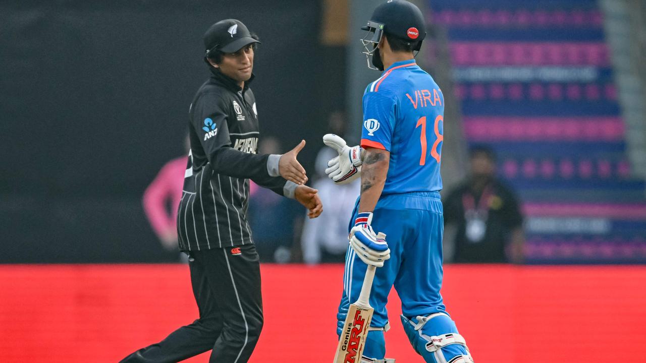 The Kiwis made sure to congratulate Kohli on his hundred. (Photo by INDRANIL MUKHERJEE / AFP)