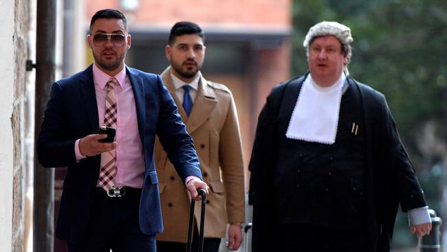 Solicitor Mahmoud Abbas (centre) has represented clients including Salim Mehajer (left). Picture: AAP Image/Brendan Esposito