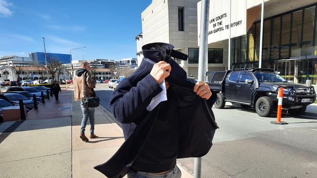 Kyong Shik Choi, also known as Kenny Choi, leaves the ACT Magistrates Court after being charged with the assault of a child. Picture: Craig Dunlop