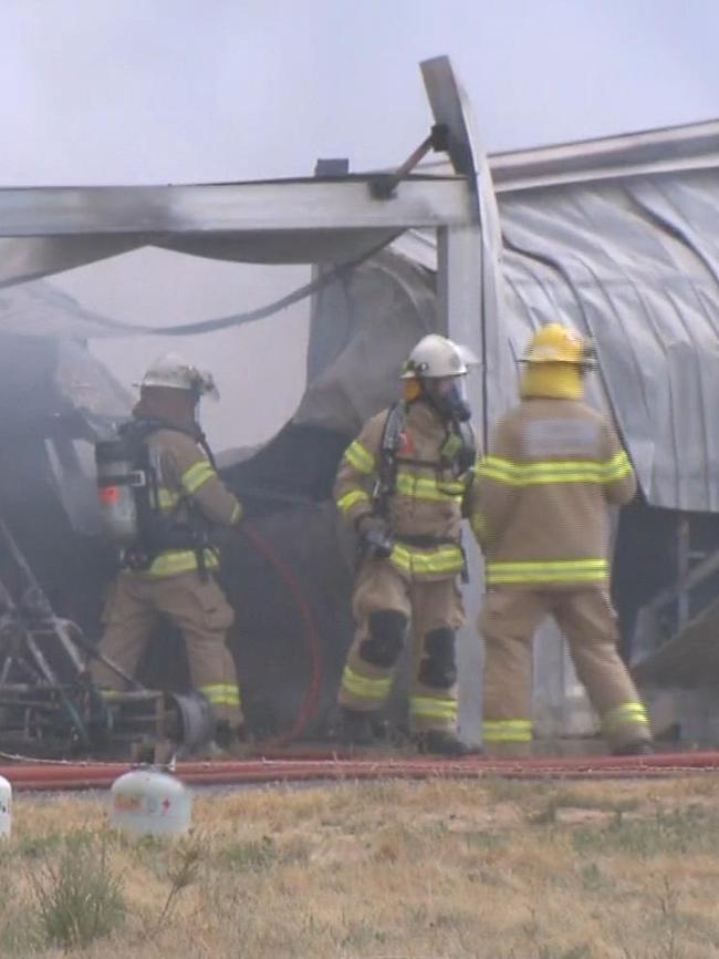 Police and fire crews attend a shed fire at Waterloo Corner. Picture: 7NEWS