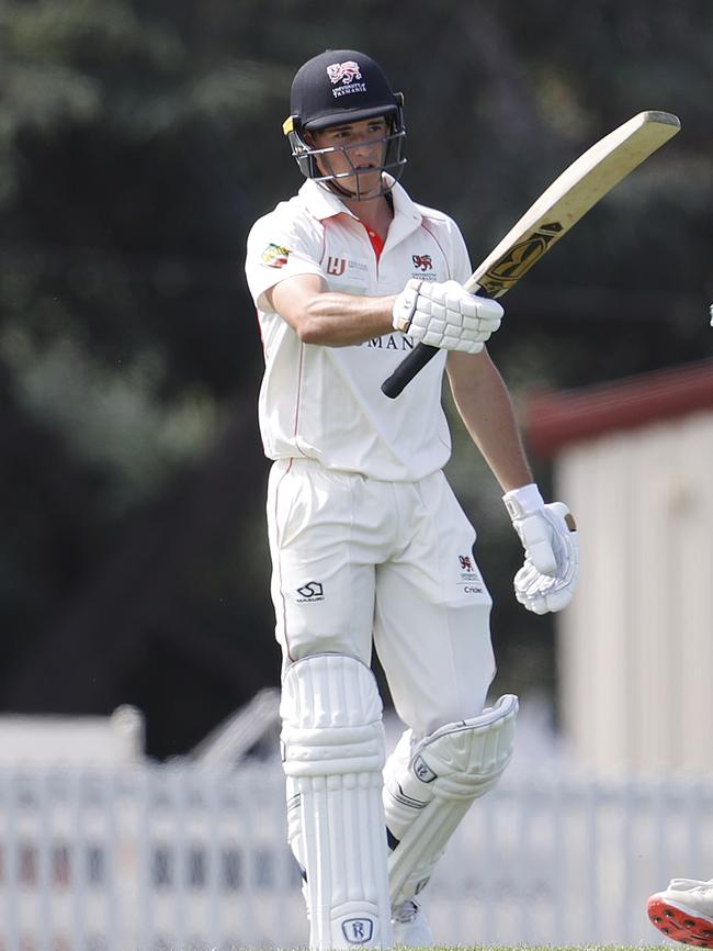 Tim Ward raises the bat after reaching his century. Picture: ZAK SIMMONDS