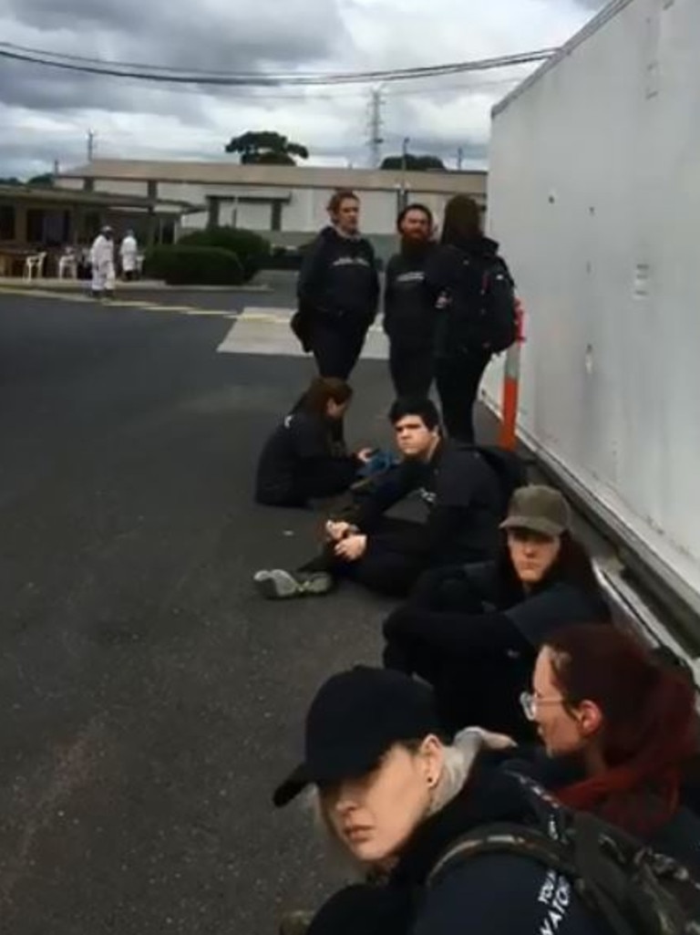 Activists outside as they are arrested.