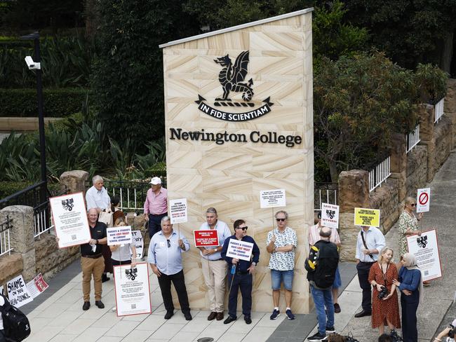 Jan 31: Parents and old boys with placards during a silent protest against the proposed switch to Newington College becoming a co-ed school. Picture: Richard Dobson