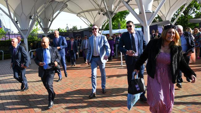 Excited Cup attendees race to get the best spots on the field. Photo by Vince Caligiuri/Getty Images)