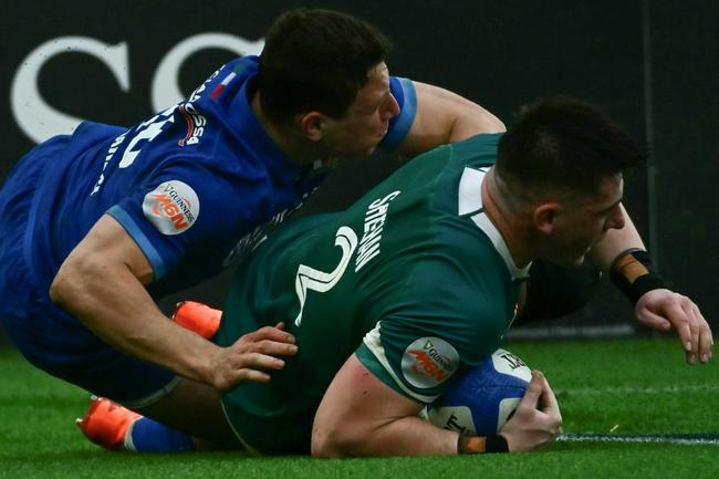 Three of a kind: Ireland hooker Dan Sheehan scores one of his hat-trick of tries against Italy