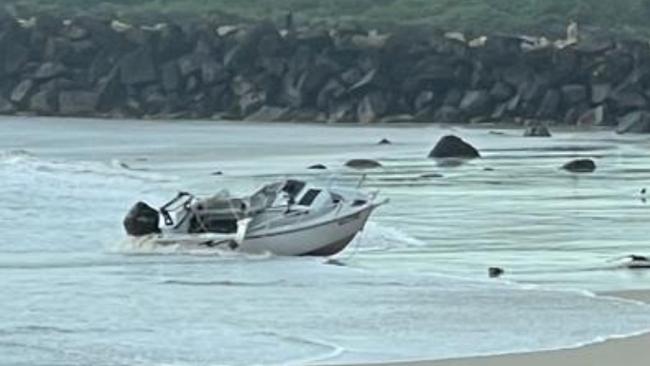 One man died and another had to be rescued after this boat capsized in the Tweed River. Picture: Troy Brown