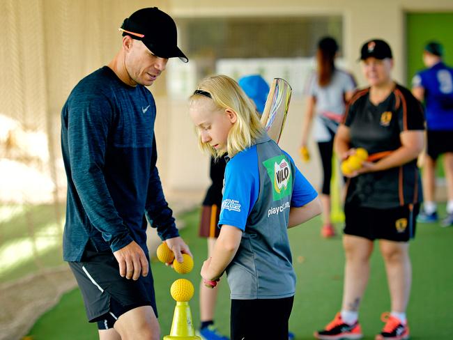 David Warner with Hannah McRostie at a coaching clinic. Picture: Michael Franchi