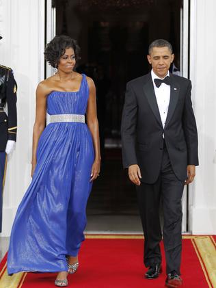 The tuxedo on one its earlier outings for a State dinner in 2010 while Mrs Obama wore a blue Soronen gown. Picture: Pablo Martinez Monsivais/AP