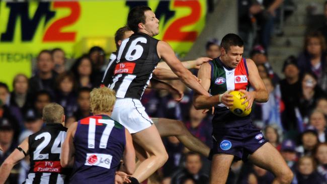 Fremantle Dockers v Collingwood Magpies at Subiaco Oval , Perth . Adam Campbell takes a mark in the forward line resulting in a goal .