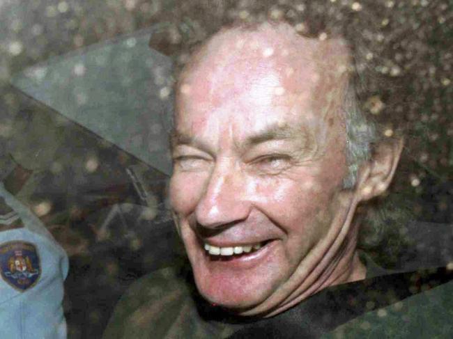 Convicted serial killer Ivan Milat smiles in a police car after attending a court in Sydney, 04/11/1997 file photo. Milat, (64), who was convicted in 1996 of murdering young travelers, used a serrated plastic knife that came with his meal to sever the finger from his left hand in his prison cell and attempted to mail it to the country's top court 26/01/2009.