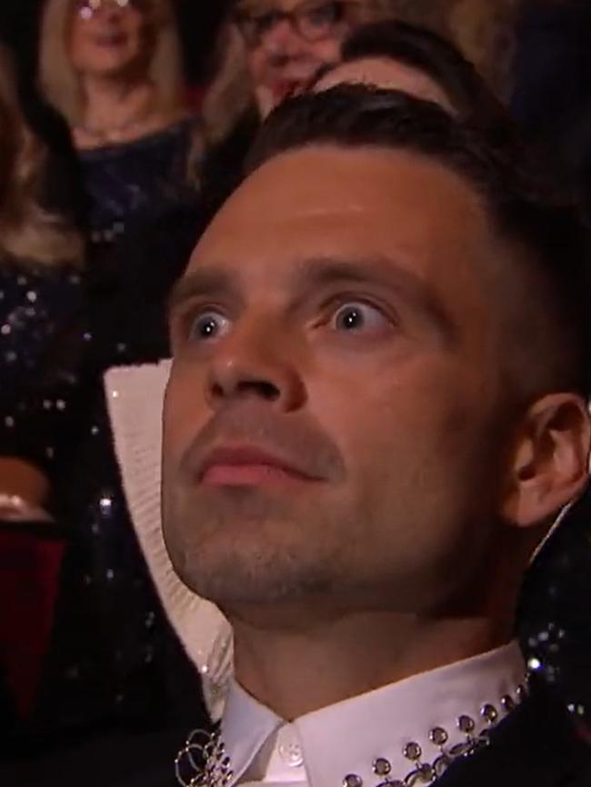 The camera flashed to an awkward Sebastian Stan.