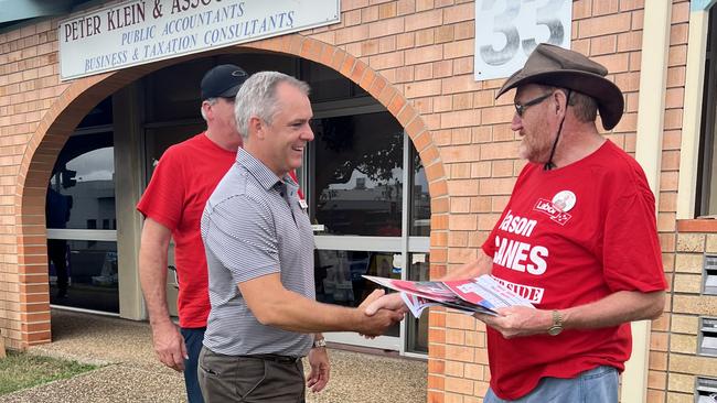 Labor candidate for Hinkler Jason Scanes greets one of his volunteers at the Maryborough Street booth in Bundaberg.