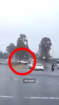 Hilux crashes on wet road trying to beat the traffic lights