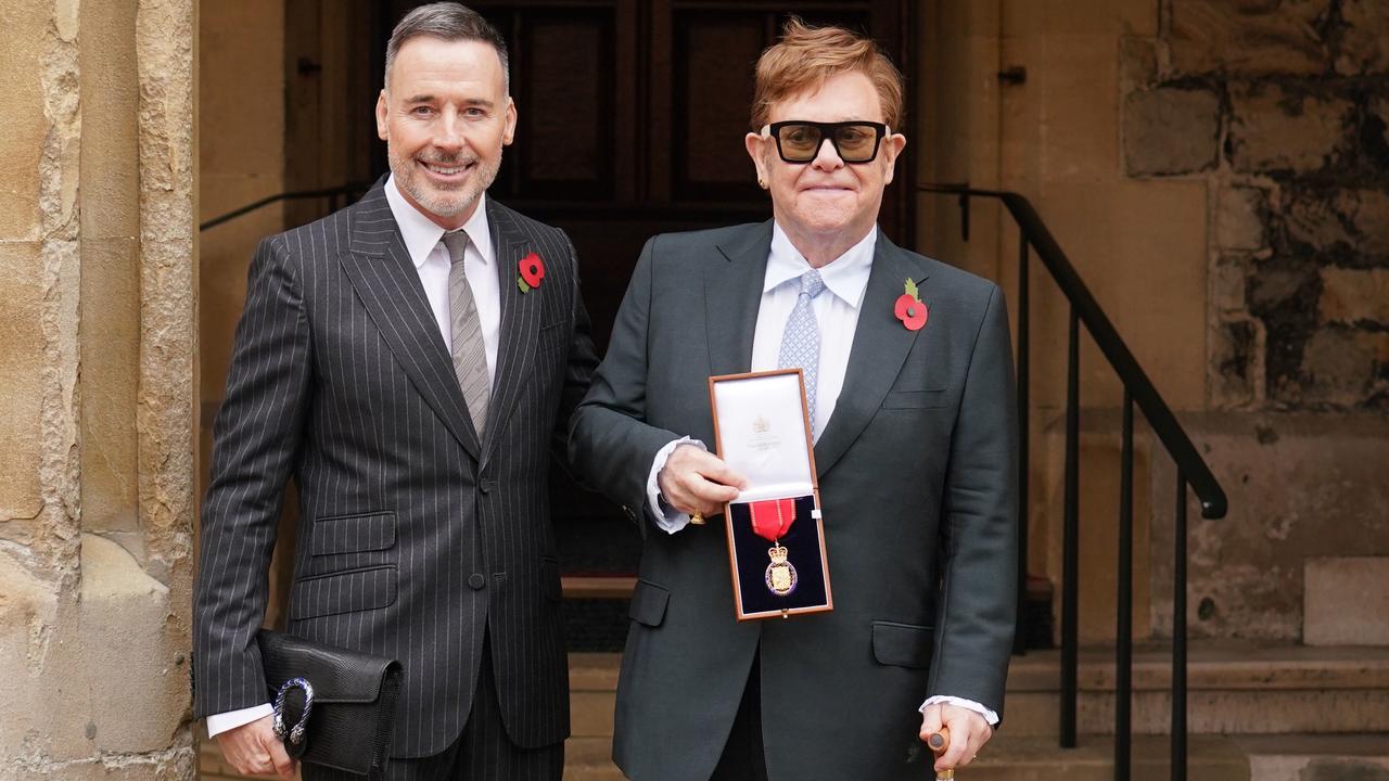 Sir Elton John, with his partner David Furnish, after being made a member of the Order of the Companions of Honour. Picture: WPA Pool/Getty Images