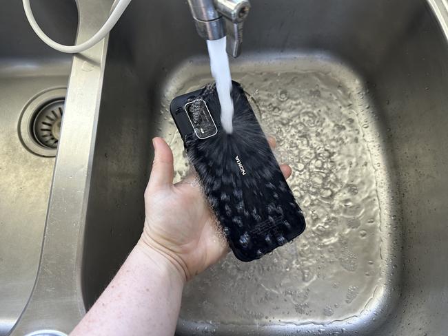 Incredibly — as this photo shows — the Nokia XR21 can survive a dousing with water.