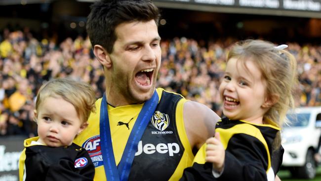 Trent Cotchin with his children Mackenzie and Harper after the Tigers won the AFL premiership. Picture: Nicole Garmston