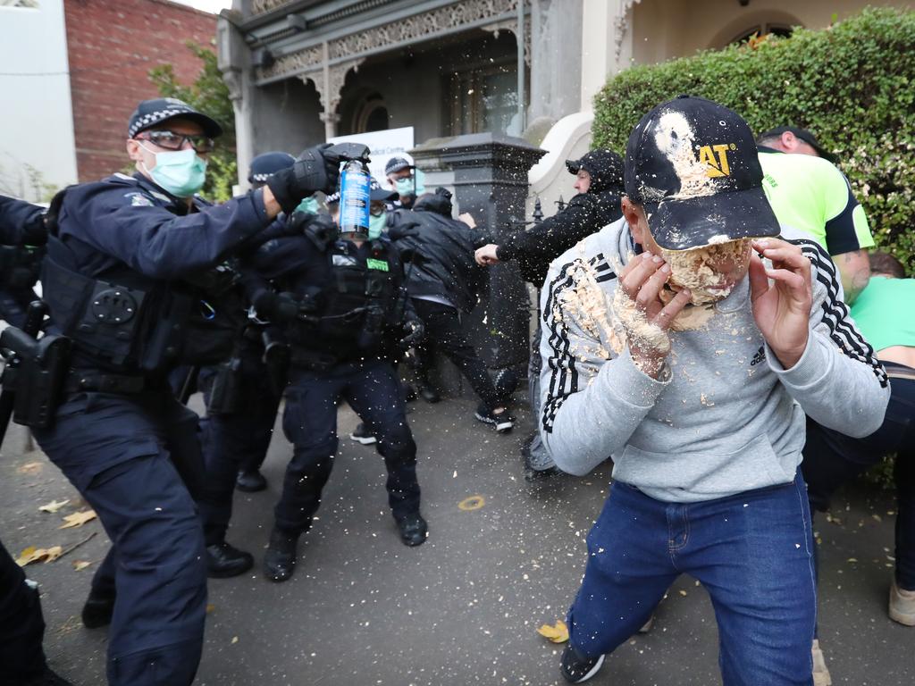 Police arrest a group in North Melbourne during anti-lockdown protests. Picture: Alex Coppel