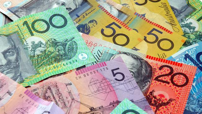 Australian notes scattered on a table. Click to see more... Picture: istock