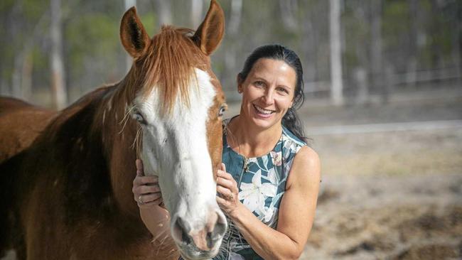 COUNTRY LIFE: Centre manager of Country Universities Centre Clarence Valley Melanie Lamb with one of her horses. Picture: Adam Hourigan