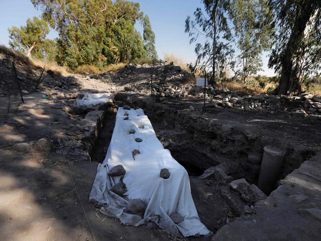 CORRECTION - A picture taken on August 6, 2017, shows a general view of an archeological excavation site, believed to be the location of a biblical village that was home to Saint Peter, near the Sea of Galilee in northern Israel. Israeli and American archaeologists have likely uncovered the lost Roman city of Julias near the banks of the lake, also known as Lake Tiberias, Mordechai Aviam of Kinneret Institute for Galilean Archeaology said. / AFP PHOTO / MENAHEM KAHANA / “The erroneous mention[s] appearing in the metadata of this photo by MENAHEM KAHANA has been modified in AFP systems in the following manner: [A picture taken on August 6, 2017, shows a man walking next to an archeological excavation site, believed to be the location of a biblical village that was home to Saint Peter, near the Sea of Galilee in northern Israel.] instead of [A picture taken on August 6, 2017, shows a man walking next to an archeological excavation site, believed to be the lost Roman city of Julias where three of Jesus’s apostles had lived, near the northern shore of the Sea of Galilee, in the Bethsaida Valley Nature Reserve.]. Please immediately remove the erroneous mention[s] from all your online services and delete it (them) from your servers. If you have been authorized by AFP to distribute it (them) to third parties, please ensure that the same actions are carried out by them. Failure to promptly comply with these instructions will entail liability on your part for any continued or post notification usage. Therefore we thank you very much for all your attention and prompt action. We are sorry for the inconvenience this notification may cause and remain at your disposal for any further information you may require.”